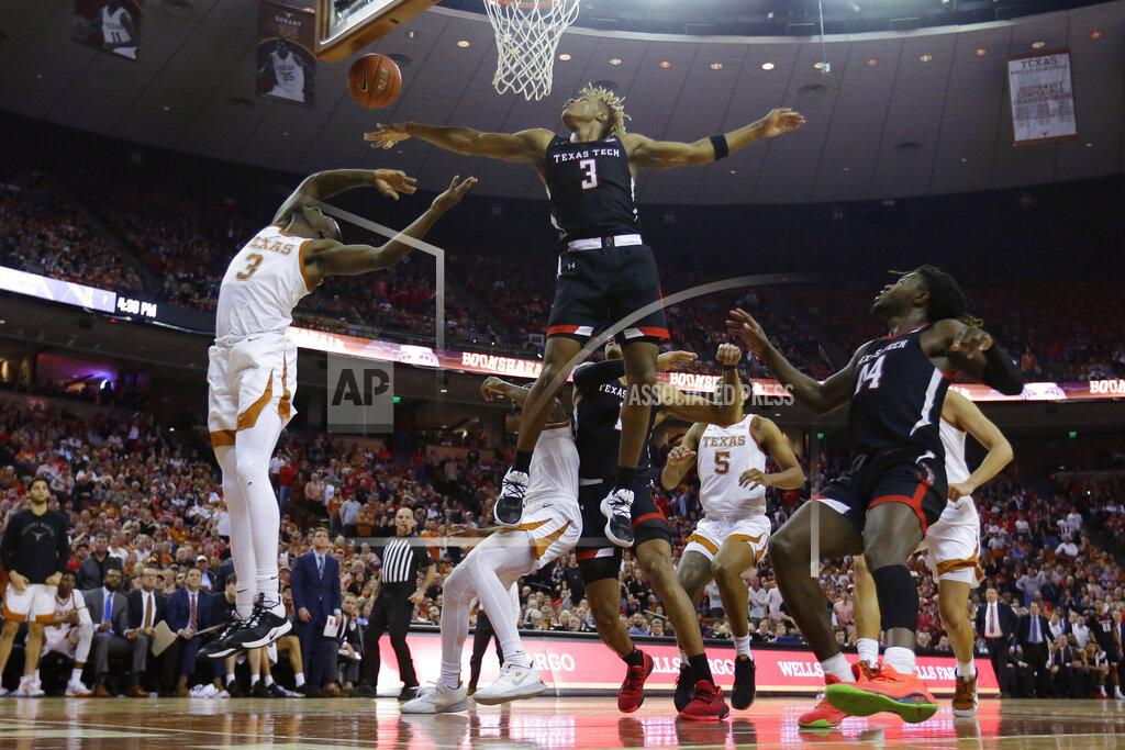 Eric Gay Texas guard Courtney Ramey, left, is blocked by Texas Tech guard Jahmi'us Ramsey (3) as he tries to score during the second half of an NCAA college basketball game, Saturday, Feb. 8, 2020, in Austin, Texas. Texas Tech won 62-57. (AP Photo/Eric Gay)