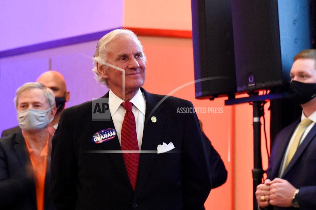 Meg Kinnard South Carolina Gov. Henry McMaster listens as Sen. Lindsey Graham, R-S.C., speaks Tuesday, Nov. 3, 2020, after winning re-election, in Columbia, S.C. (AP Photo/Meg Kinnard)