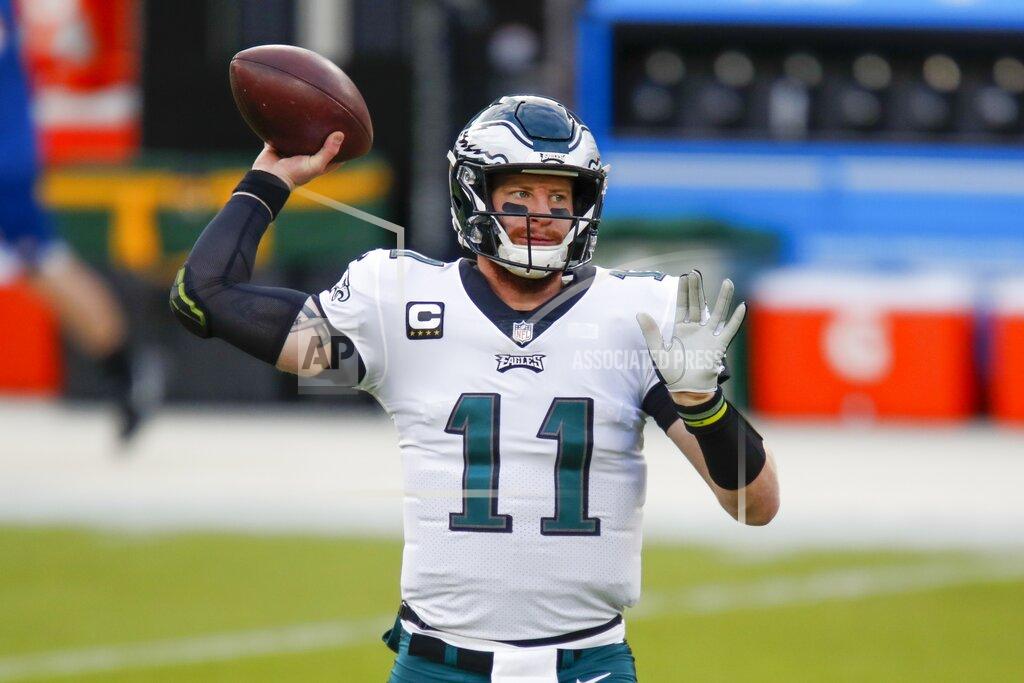Matt Ludtke Philadelphia Eagles' Carson Wentz warms up before an NFL football game against the Green Bay Packers Sunday, Dec. 6, 2020, in Green Bay, Wis. (AP Photo/Matt Ludtke)