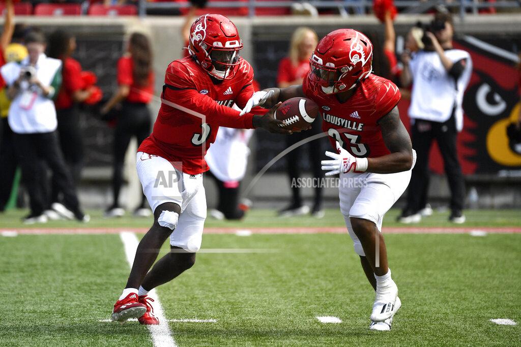 Timothy D. Easley Louisville quarterback Malik Cunningham (3) hands the ball off to running back Trevion Cooley (23) during the second half of an NCAA college football game against South Florida in Louisville, Ky., Saturday, Sept. 24, 2022. Louisville won 41-3. (AP Photo/Timothy D. Easley)