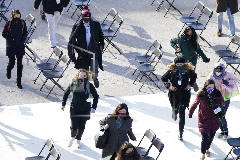 Carolyn Kaster People evacuate from the West Front of the U.S. Capitol during a rehearsal the 59th Presidential Inauguration at the U.S. Capitol in Washington, Monday, Jan. 18, 2021. (AP Photo/Carolyn Kaster)