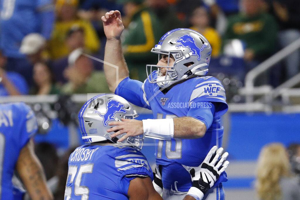 Rick Osentoski Detroit Lions quarterback David Blough is lifted by teammate offensive tackle Tyrell Crosby (65) after scoring on a 19-yard reception during the first half of an NFL football game against the Green Bay Packers, Sunday, Dec. 29, 2019, in Detroit. (AP Photo/Rick Osentoski)