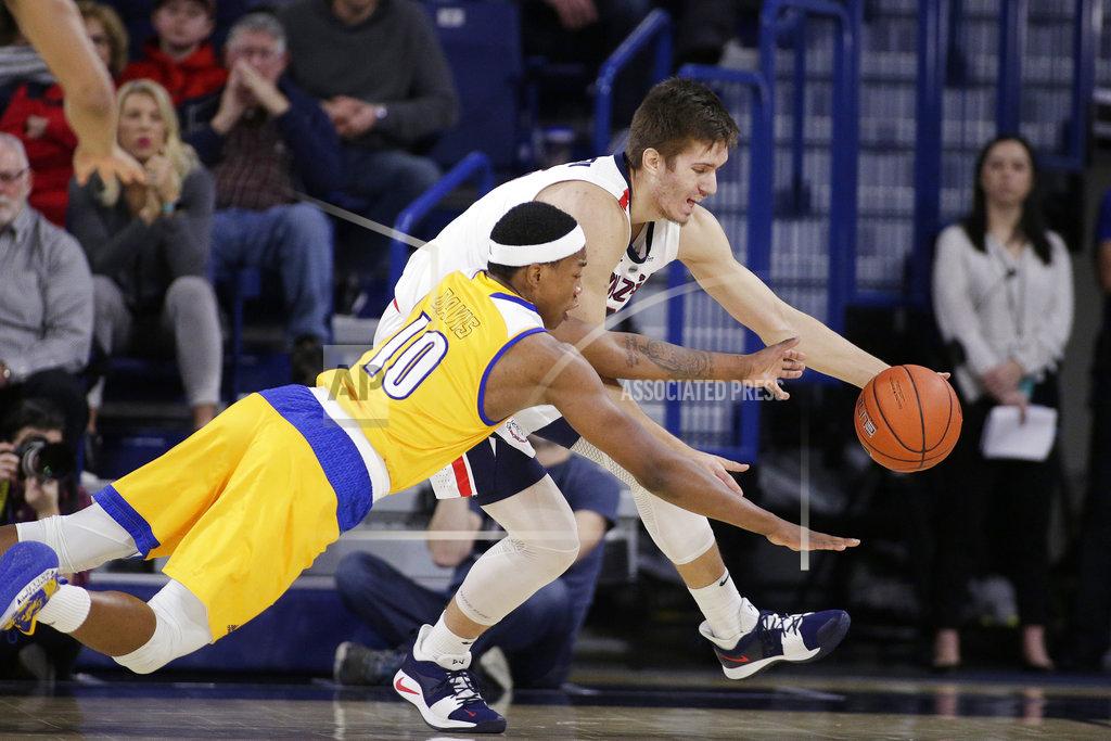 Young Kwak Cal State Bakersfield guard Justin Edler-Davis (10) and Gonzaga forward Filip Petrusev go after the ball during the first half of an NCAA college basketball game in Spokane, Wash., Monday, Dec. 31, 2018. (AP Photo/Young Kwak)