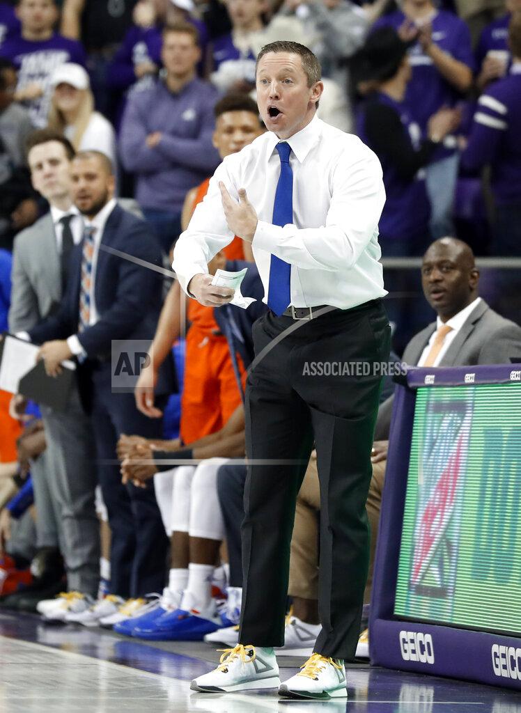Tony Gutierrez Florida head coach Mike White and members of his staff look on during the second half of an NCAA college basketball game against TCU in Fort Worth, Texas, Saturday, Jan. 26, 2019. (AP Photo/Tony Gutierrez)