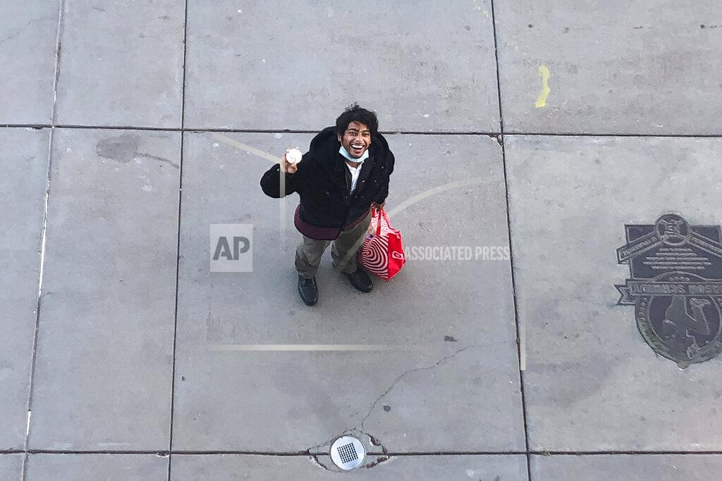 Janie Mccauley A fan named Casey, last name not given, smiles while holding a ball on the portwalk below Oracle Park after a baseball game between the San Francisco Giants and the Seattle Mariners, Thursday, Sept. 17, 2020, in San Francisco. (AP Photo/Janie McCauley).