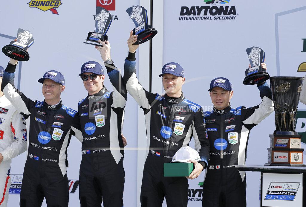 Terry Renna From left to right, Konica Minolta Cadillac DPi-V.R drivers Ryan Briscoe, Scott Dixon, Renger van der Zande, and Kamui Kobayashi hold up their trophies in Victory Lane after winning the Rolex 24-hour auto race at Daytona International Speedway, Sunday, Jan. 26, 2020, in Daytona Beach, Fla. (AP Photo/Terry Renna)