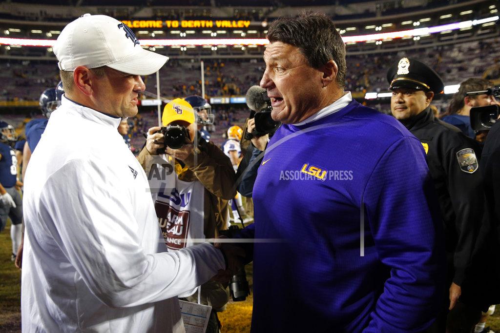 Gerald Herbert LSU head coach Ed Orgeron, right, greets Rice head coach Mike Bloomgren after an NCAA college football game in Baton Rouge, La., Saturday, Nov. 17, 2018. LSU won 42-10. (AP Photo/Gerald Herbert)