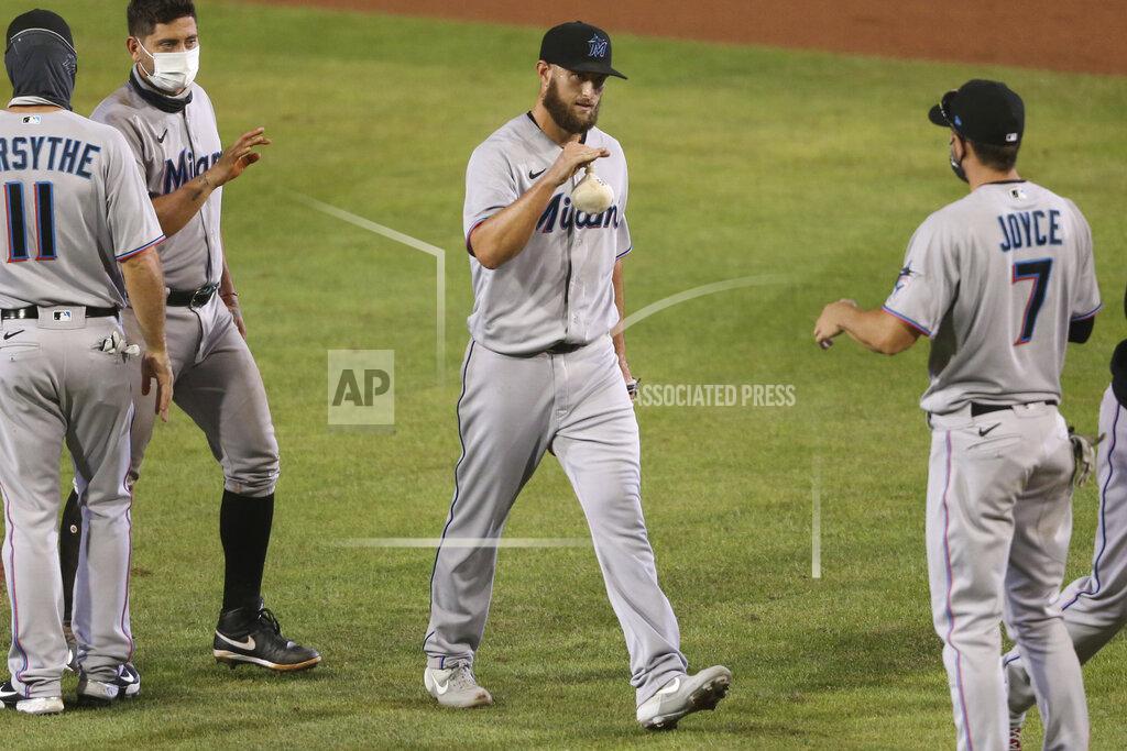 Jeffrey T. Barnes Miami Marlins pitcher Josh A. Smith celebrates his win with teammates following the tenth inning of a baseball game against the Toronto Blue Jays, Wednesday, Aug. 12, 2020, in Buffalo, N.Y. (AP Photo/Jeffrey T. Barnes)