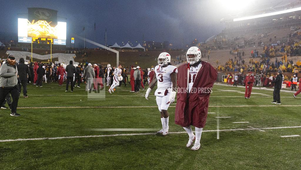 L.g. Patterson The Arkansas team walks off the field after a 38-0 loss to Missouri in an NCAA college football game Friday, Nov. 23, 2018, in Columbia, Mo. (AP Photo/L.G. Patterson)