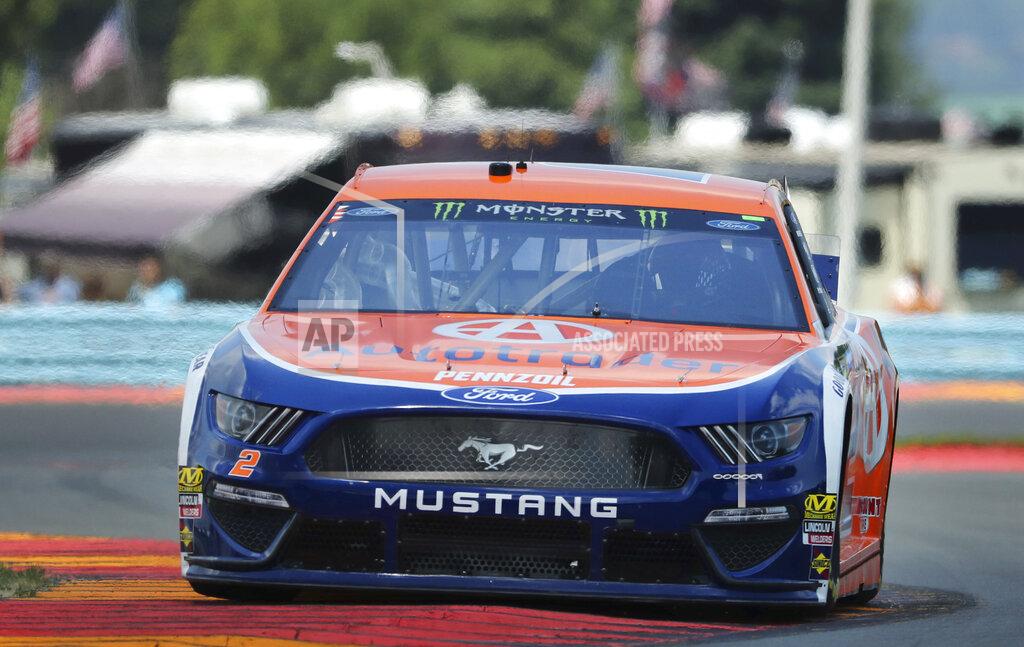 John Munson Brad Keselowski (2) heads through the area known as "The Bus Stop" during a practice run for a NASCAR Cup Series auto race at Watkins Glen International, Saturday, Aug. 3, 2019, in Watkins Glen, N.Y. (AP Photo/John Munson)