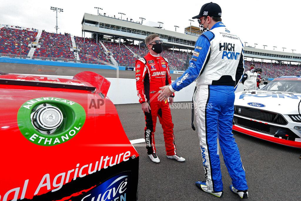 Ralph Freso Justin Allgaier, left, and Chase Briscoe talk on pit road prior to the NASCAR Xfinity Series auto race at Phoenix Raceway, Saturday, Nov. 7, 2020, in Avondale, Ariz. (AP Photo/Ralph Freso)
