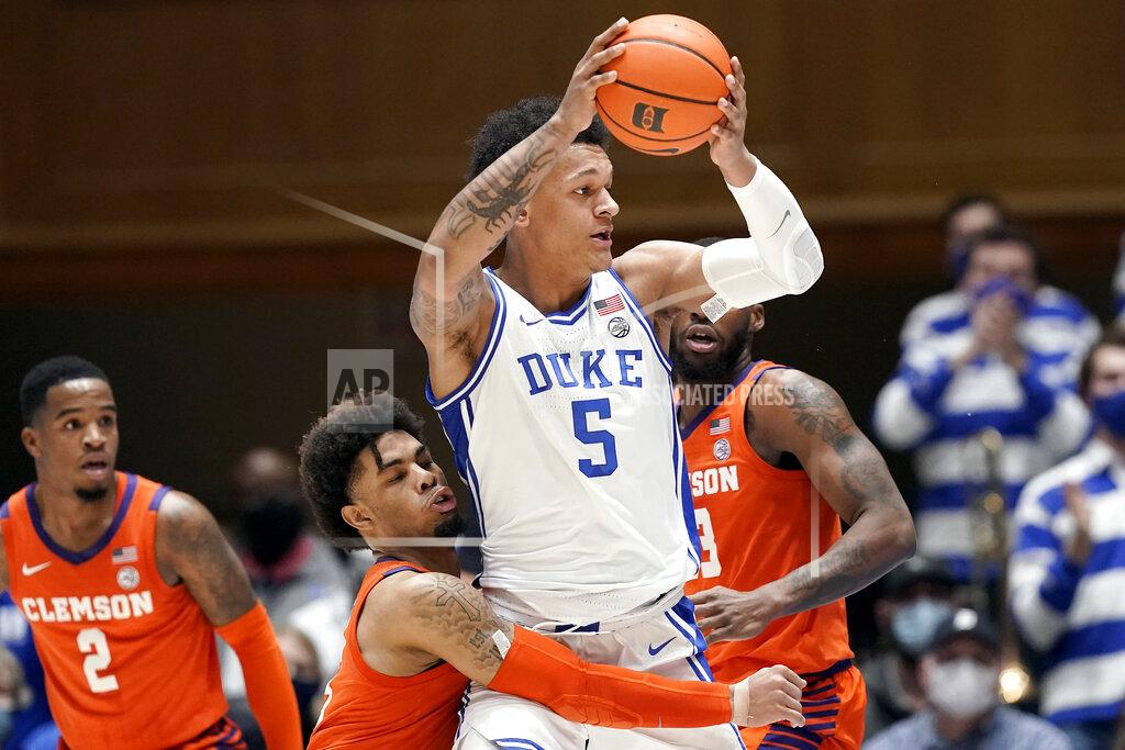 Gerry Broome Duke forward Paolo Banchero (5) looks to pass while Clemson guard David Collins defends during the first half of an NCAA college basketball game in Durham, N.C., Tuesday, Jan. 25, 2022. (AP Photo/Gerry Broome)
