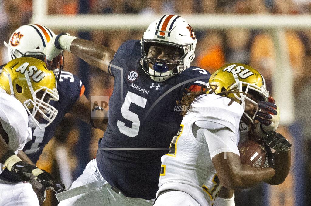 Vasha Hunt FILE - In this Sept. 8, 2018, file photo, Auburn defensive lineman Derrick Brown (5) stops Alabama State running back Tallesin Farmer during an NCAA college football game in Auburn, Ala. Auburn, which plays Oregon this week, has one of the top defensive lines, led by preseason All-America tackle Brown. (AP Photo/Vasha Hunt, File)