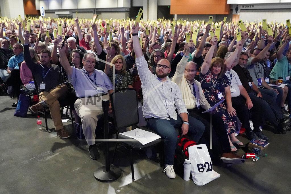 Mark Humphrey People vote on a motion during the annual Southern Baptist Convention meeting Tuesday, June 15, 2021, in Nashville, Tenn. (AP Photo/Mark Humphrey)