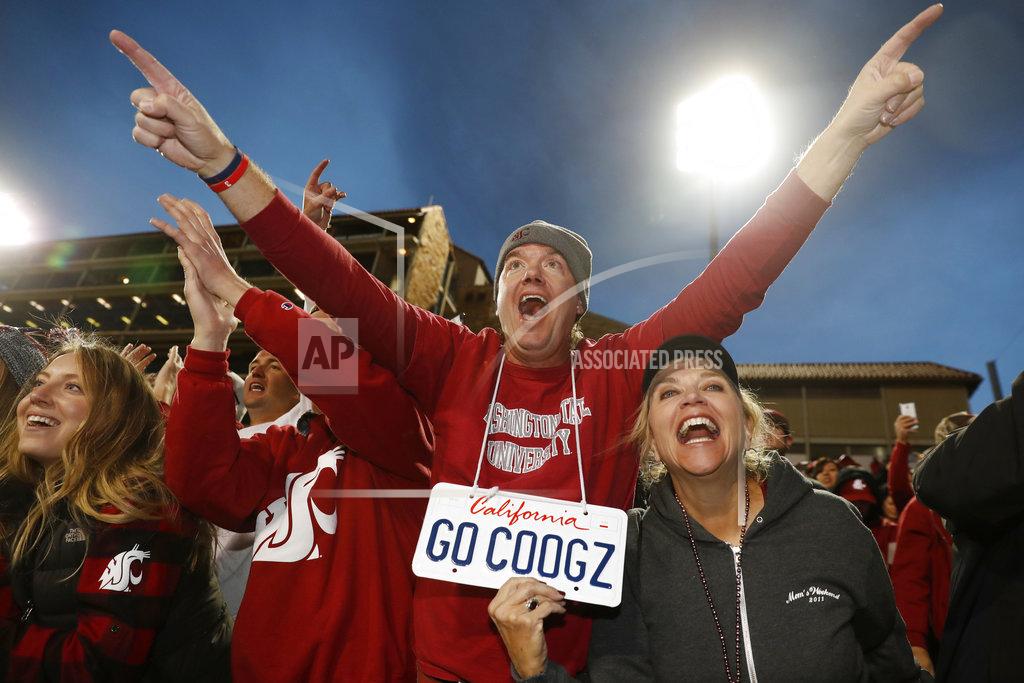 David Zalubowski Washington State fans celebrate after an NCAA college football game against Colorado Saturday, Nov. 10, 2018, in Boulder, Colo. Washington State won 31-7. (AP Photo/David Zalubowski)