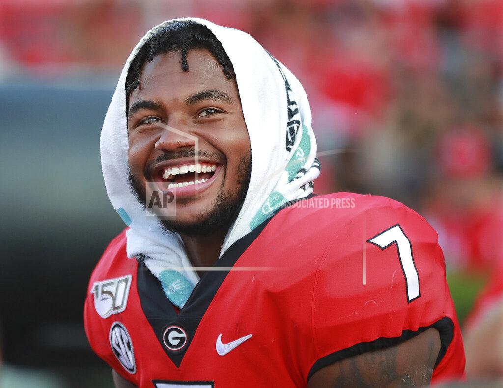 Curtis Compton Georgia tailback D'Andre Swift smiles on the sideline during the fourth quarter of the team's NCAA college football game against Murray State on Saturday, Sept. 7, 2019, in Athens, Ga. (Curtis Compton/Atlanta Journal Constitution via AP)