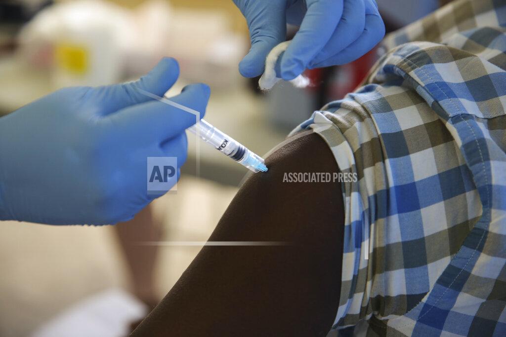 Joseph Odelyn A person gets a shot of the Moderna vaccine for COVID-19 at Saint Damien Hospital in Port-au-Prince, Haiti, Tuesday, July 27, 2021. After months of not having any vaccines in the country, the U.S. donated 500,000 doses through the U.N. COVAX system for Haiti in mid-July. (AP Photo/Joseph Odelyn)