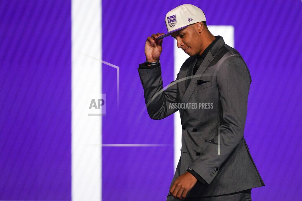 John Minchillo Keegan Murray walks across the stage after being selected fourth overall by the Sacramento Kings in the NBA basketball draft, Thursday, June 23, 2022, in New York. (AP Photo/John Minchillo)
