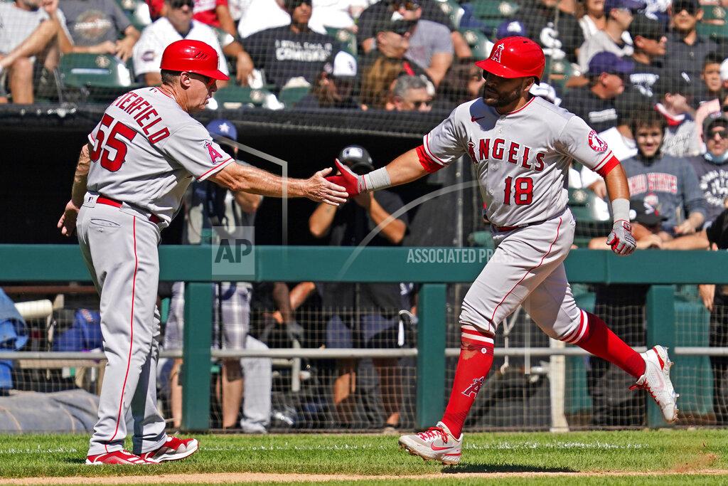 Nam Y. Huh Los Angeles Angels' Jose Rojas, right, celebrates with third base coach Brian Butterfield after hitting a two-run home run during the fourth inning of a baseball game against the Chicago White Sox in Chicago, Thursday, Sept. 16, 2021. (AP Photo/Nam Y. Huh)