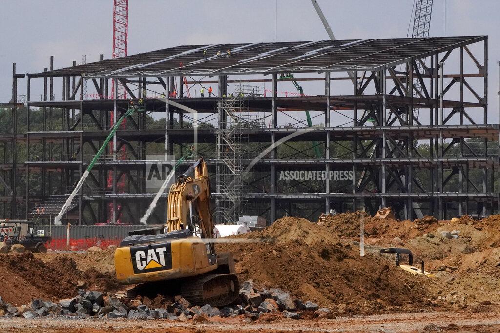 Chris Carlson Construction personnel work on Carolina Panthers' state-of-the-art team headquarters and practice facility Tuesday, Aug. 24, 2021, in Rock Hill, S.C. "The Rock" will host all of the team's offices and training/locker room facilities, along with three outdoor grass practice fields, one indoor artificial field and another outdoor artificial field that is part of a 5,000-seat multipurpose stadium that can also be used to host high school football and soccer games, concerts, car shows and much more. (AP Photo/Chris Carlson)