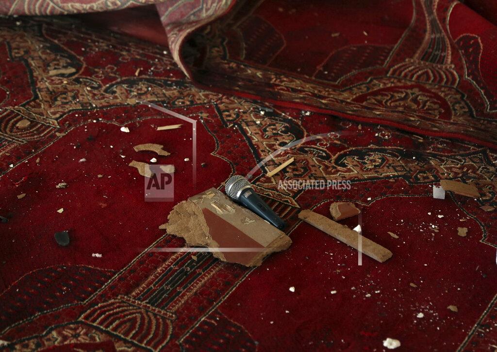 Rahmat Gul A mic is seen inside a mosque after a bomb explosion in Shakar Dara district of Kabul, Afghanistan, Friday, May 14, 2021. A bomb ripped through a mosque in northern Kabul during Friday prayers killing 12 worshippers, Afghan police said. (AP Photo/Rahmat Gul)