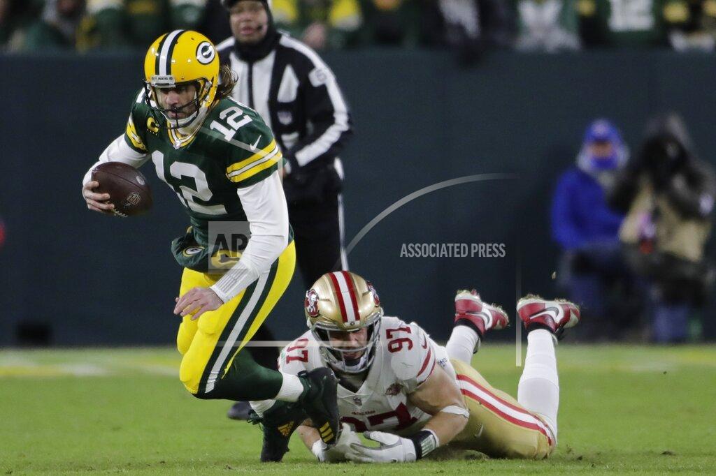 Aaron Gash San Francisco 49ers' Nick Bosa sacks Green Bay Packers' Aaron Rodgers during the first half of an NFC divisional playoff NFL football game Saturday, Jan. 22, 2022, in Green Bay, Wis. (AP Photo/Aaron Gash)
