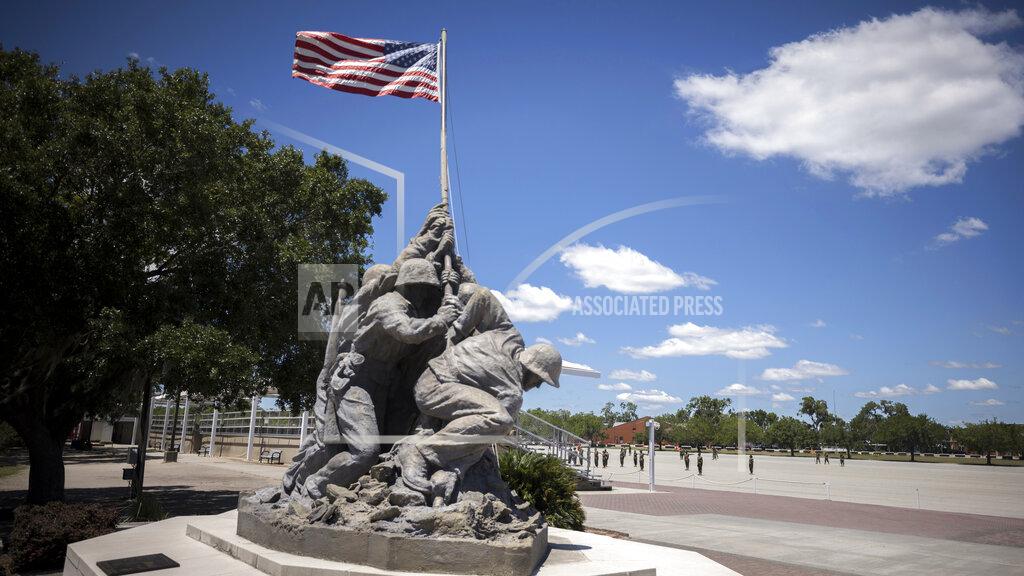 Stephen B. Morton A smaller scale replica of the Marine Corps War Memorial statue stands near the parade ground at the Marine Corps Recruiting Depot, Wednesday, May 11, 2022, in Parris Island, S.C. The threat of rising seas is encroaching upon one of America's most storied military installations, where thousands of recruits are molded into Marines each year. (AP Photo/Stephen B. Morton)