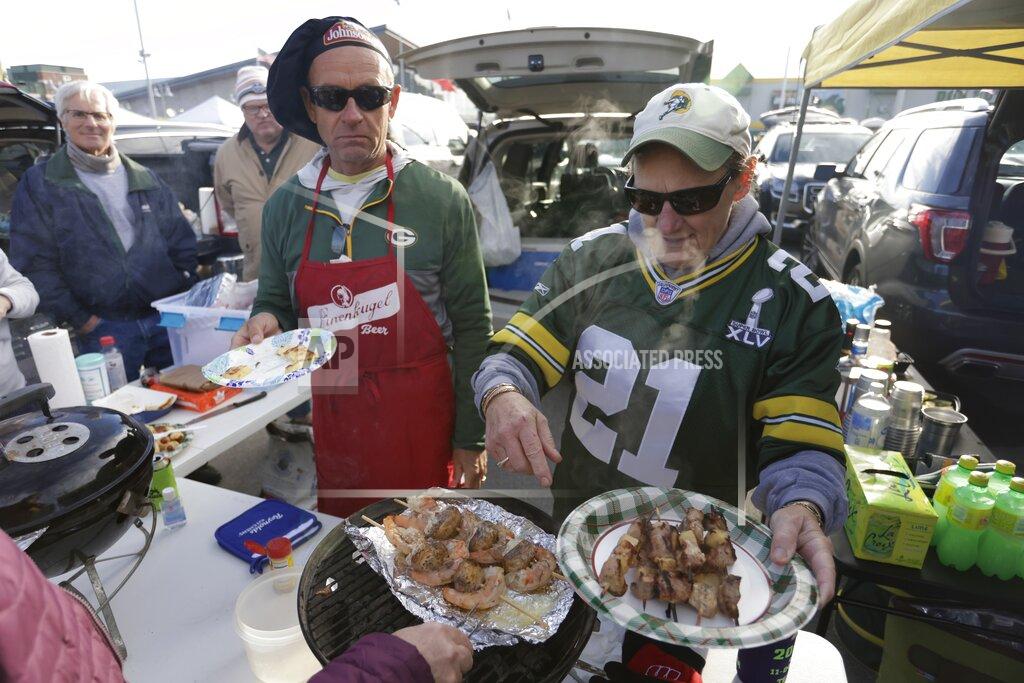 Matt Ludtke Fans outside Lambeau Field before an NFL football game between the Green Bay Packers and the Washington Football Team Sunday, Oct. 24, 2021, in Green Bay, Wis. (AP Photo/Matt Ludtke)