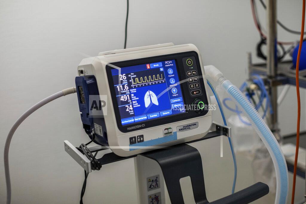 Bernat Armangue Detail of a ventilator connected to a patient infected with COVID-19 in one of the intensive care units (ICU) at the Severo Ochoa hospital in Leganes, outskirts of Madrid, Spain, Friday, Oct. 9, 2020. At the peak of the first wave, ICU wards were given over to haste, desperation and even cluelessness about what to do. Now, a well-oiled machinery saves some lives and loses others to coronavirus, but without the doomsday atmosphere of March and April. (AP Photo/Bernat Armangue)