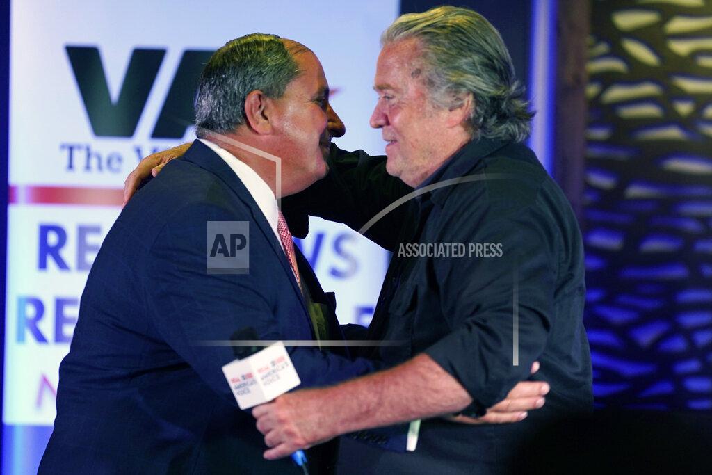 Steve Helber Political strategist Steve Bannon, right, greets talks how host John Frederick, during an election rally in Richmond, Va., Wednesday, Oct. 13, 2021. Conservative radio host John Fredericks, a former Trump campaign chairman in Virginia, organized the "Take Back Virginia Rally" in which former President Donald Trump called in. (AP Photo/Steve Helber)