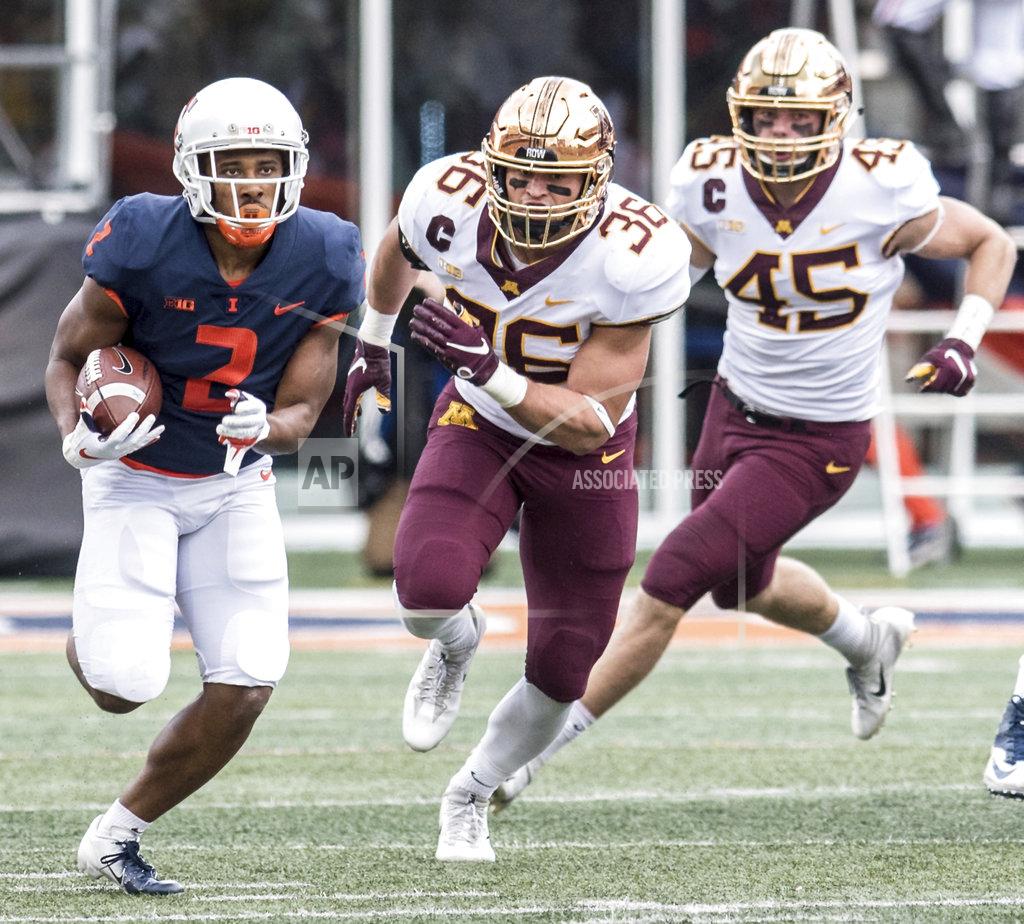 Holly Hart Illinois running back Reggie Corbin (2) runs the ball as Minnesota's Blake Cashman (36)and Carter Coughlin (45) pursue in the first half of an NCAA college football game, Saturday, Nov. 3, 2018, in Champaign, Ill. (AP Photo/Holly Hart)