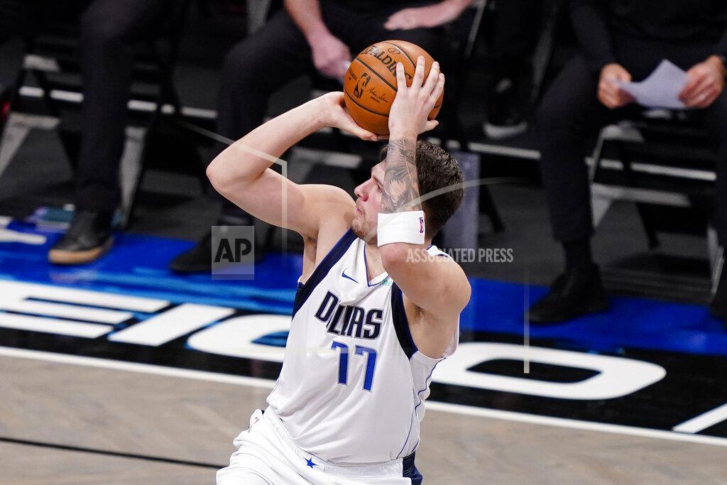 John Minchillo Dallas Mavericks guard Luka Doncic shoots during the second half of the team's NBA basketball game against the Brooklyn Nets, Saturday, Feb. 27, 2021, in New York. (AP Photo/John Minchillo)
