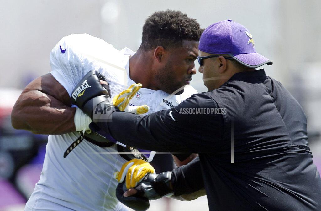 Jim Mone Minnesota Vikings defensive end Danielle Hunter, left, gets pointers during the NFL football team's training camp Monday, July 29, 2019, in Eagan, Minn. (AP Photo/Jim Mone)