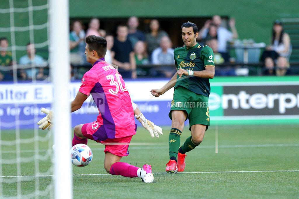 Sean Meagher Portland Timbers midfielder Diego Valeri scores his 100th MLS goal, against Los Angeles FC goalie Tomás Romero during the first half of an MLS soccer match Wednesday, July 21, 2021, in Portland, Ore. (Sean Meagher/The Oregonian via AP)