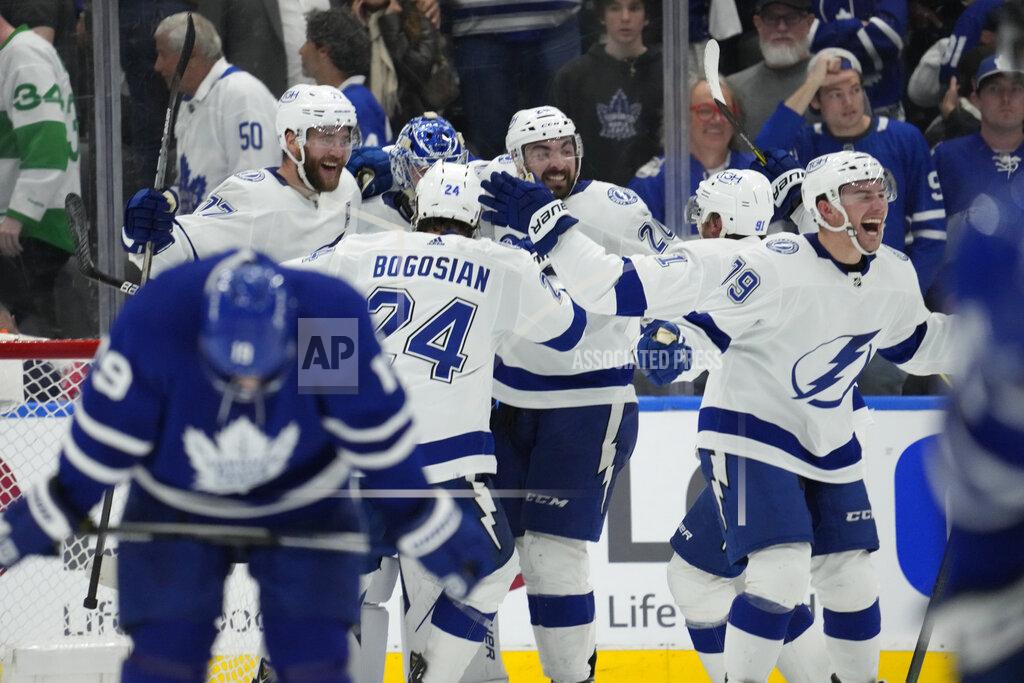 Frank Gunn Tampa Bay Lightning players celebrate after defeating the Toronto Maple Leafs in Game 7 of an NHL hockey first-round playoff series in Toronto, Saturday, May 14, 2022. (Frank Gunn/The Canadian Press via AP)