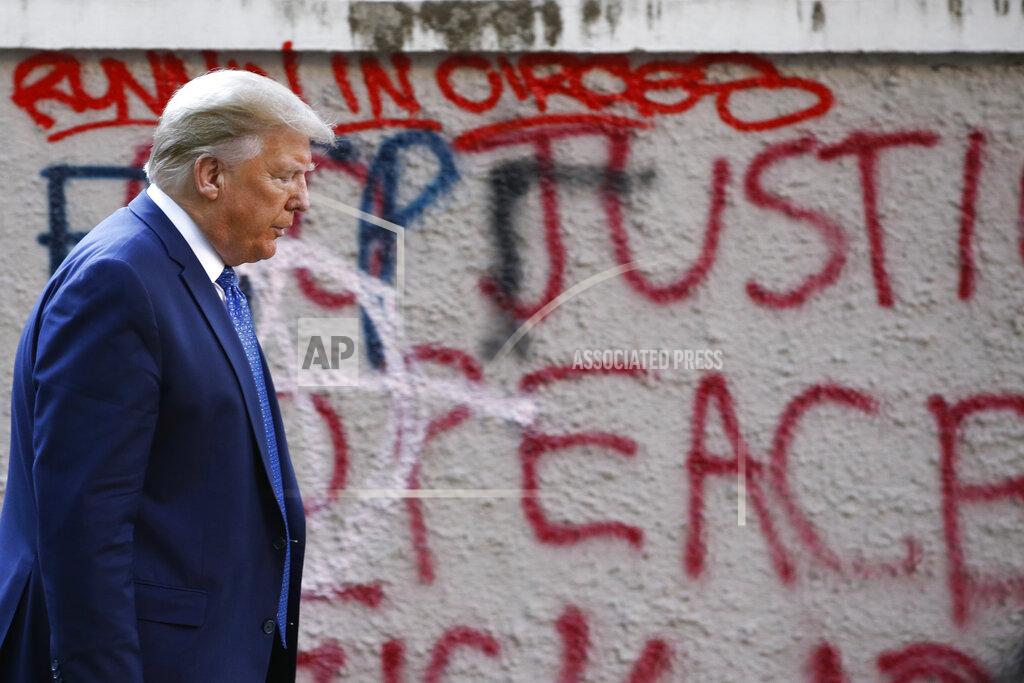 Patrick Semansky President Donald Trump walks from the White House through Lafayette Park to visit St. John's Church Monday, June 1, 2020, in Washington. (AP Photo/Patrick Semansky)
