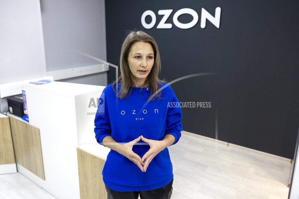 Pavel Golovkin Maria Zaikina, communications director of Ozon, a major Russian e-commerce platform similar to Amazon, speaks during an interview with The Associated Press in Moscow, Russia, Thursday, March 25, 2021. Ozon saw sales jump almost 2.5 times last year, Zaikina said. (AP Photo/Pavel Golovkin)