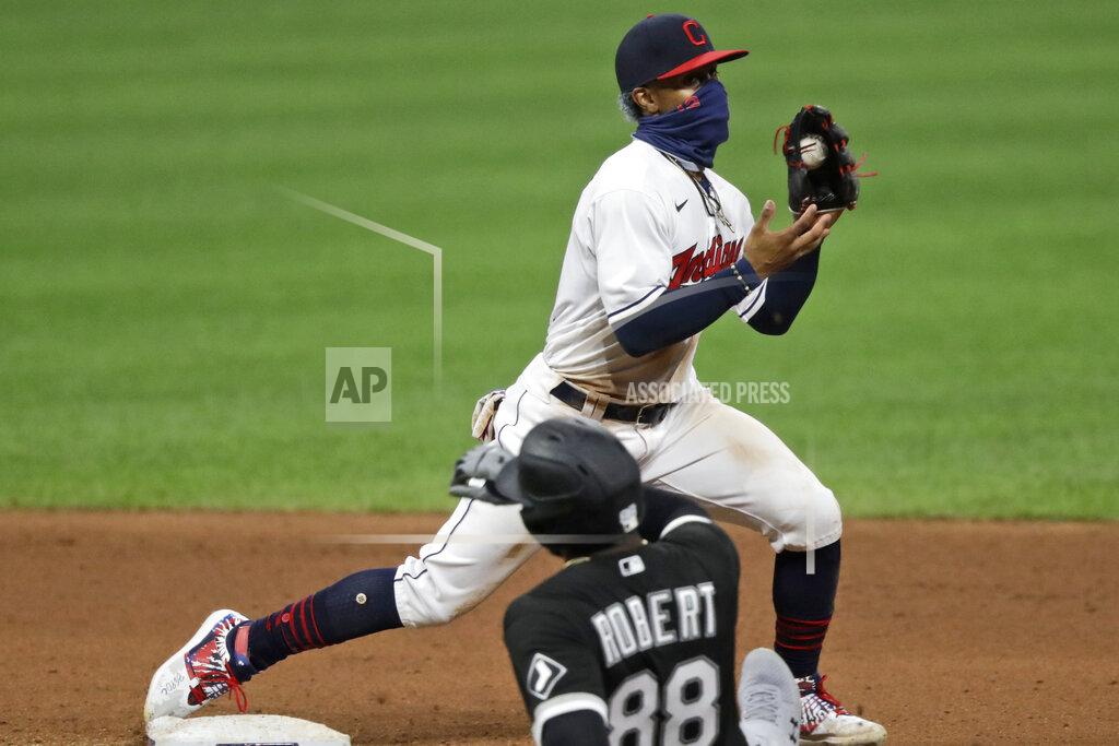 Tony Dejak Cleveland Indians' Francisco Lindor gets Chicago White Sox's Luis Robert at second base in the seventh inning in the second baseball game of a doubleheader, Tuesday, July 28, 2020, in Cleveland. (AP Photo/Tony Dejak)
