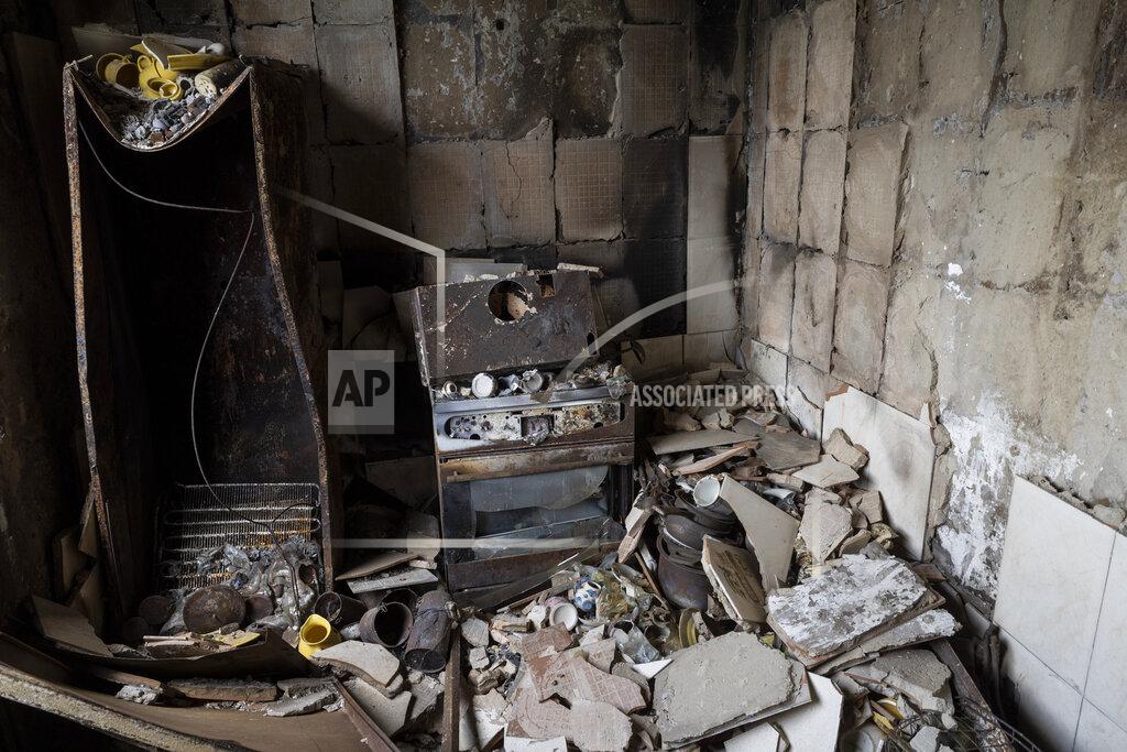 Bernat Armangue Debris cover the kitchen of an apartment damaged during shelling in Kharkiv, eastern Ukraine, Saturday, May 21, 2022. (AP Photo/Bernat Armangue)