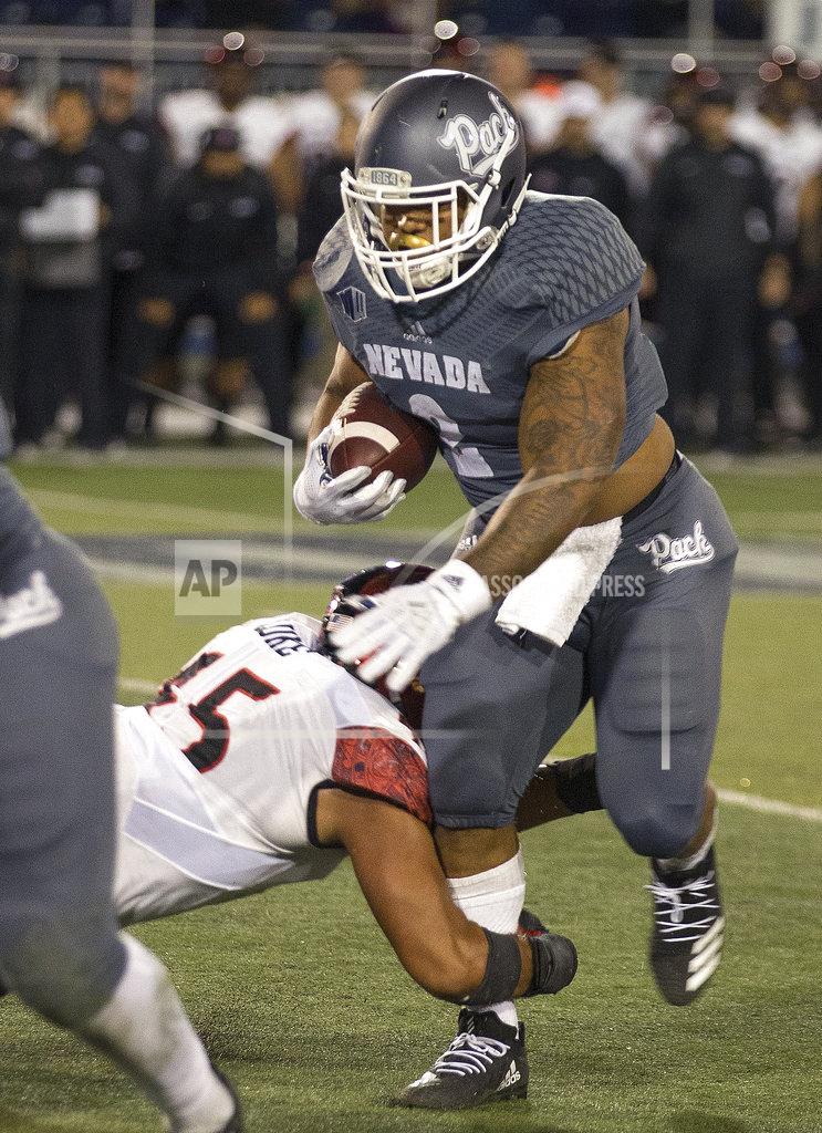 Tom R. Smedes Nevada running back Devonte Lee (2) is hit by San Diego State's Anthony Lukein (45) the second half of an NCAA college football game in Reno, Nev., Saturday, Oct. 27, 2018. (AP Photo/Tom R. Smedes)