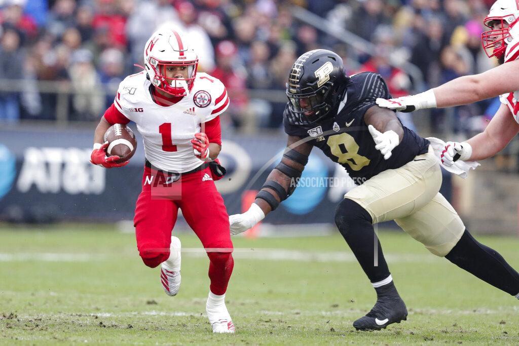 Michael Conroy Nebraska wide receiver Wan'Dale Robinson (1) is chased down by Purdue defensive tackle Anthony Watts (8) during the first half of an NCAA college football game in West Lafayette, Ind., Saturday, Nov. 2, 2019. (AP Photo/Michael Conroy)