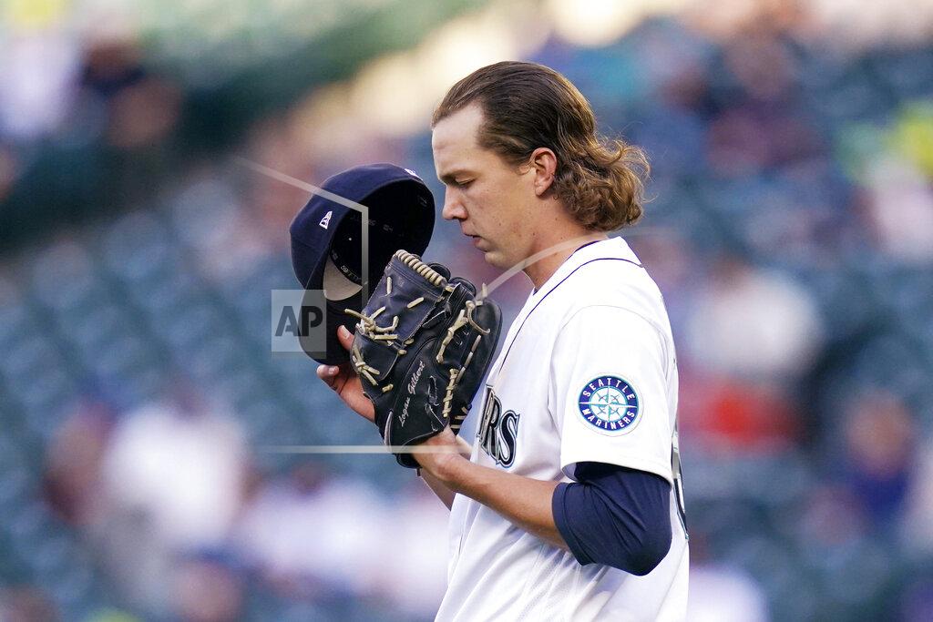 Elaine Thompson Seattle Mariners starting pitcher Logan Gilbert turns toward the outfield and pauses before throwing his first major league pitch, against the Cleveland Indians in the first inning of a baseball game Thursday, May 13, 2021, in Seattle. (AP Photo/Elaine Thompson)