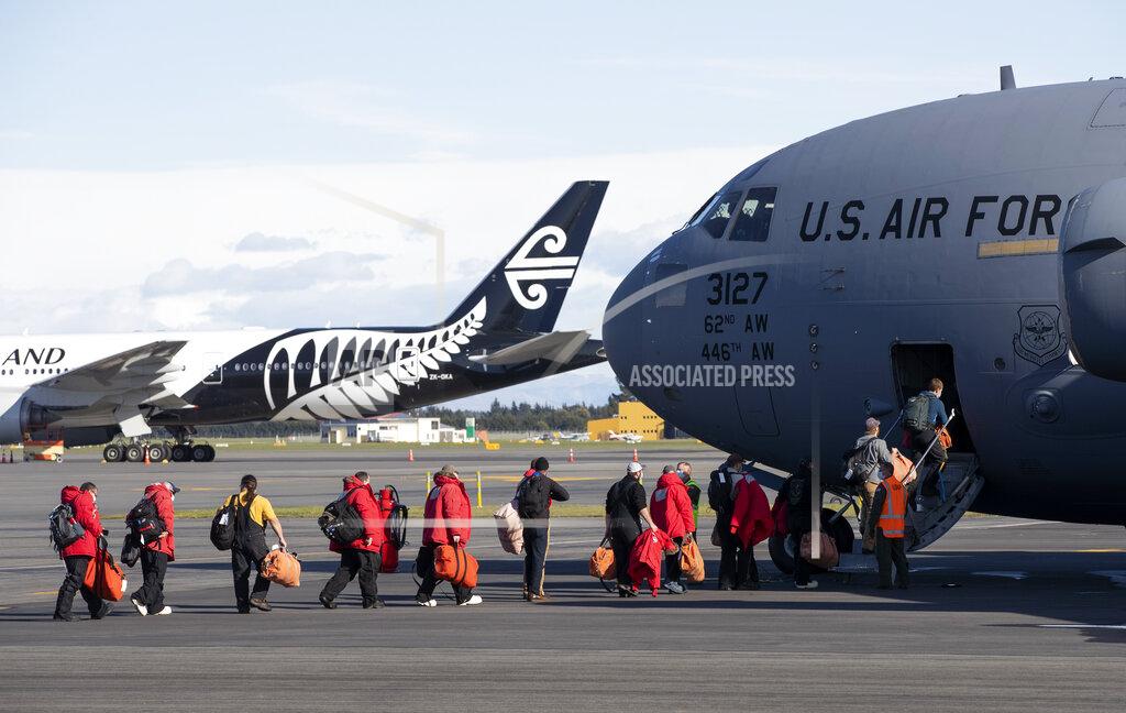 Mark Baker Staff board a U.S. Air Force C-17 as they prepare to take the season's first flight to McMurdo Station in Antarctica from Christchurch Airport, New Zealand, Monday, Sept. 14, 2020. The first U.S. flight into Antarctica following months of winter darkness left from New Zealand Monday with crews extra vigilant about keeping out the coronavirus. (AP Photo/Mark Baker)