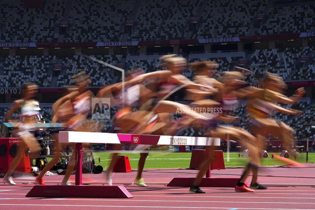 Petr David Josek Runners compete in a heat of the women's 3,000-meter steeplechase at the 2020 Summer Olympics, Sunday, Aug. 1, 2021, in Tokyo. (AP Photo/Petr David Josek)