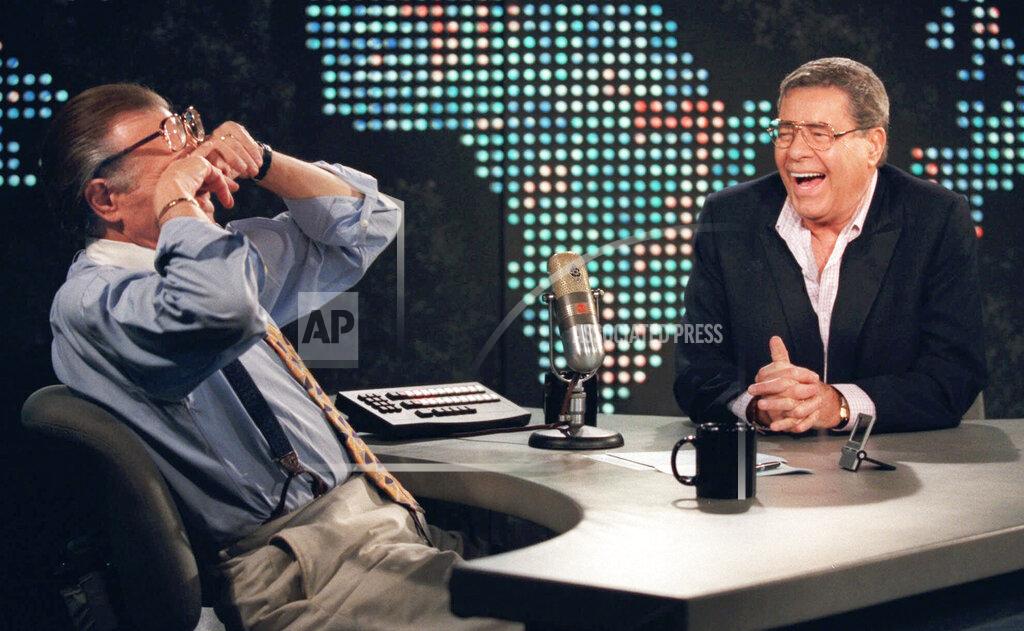 Chris Pizzello FILE - In this Thursday, Aug. 26, 1999, file photo, talk show host Larry King wipes his eyes after laughing at a joke by comedy legend Jerry Lewis, on the set of "Larry King Live" at CNN Studios in the Hollywood section of Los Angeles. King, who interviewed presidents, movie stars and ordinary Joes during a half-century in broadcasting, has died at age 87. Ora Media, the studio and network he co-founded, tweeted that King died Saturday, Jan. 23, 2021 morning at Cedars-Sinai Medical Center in Los Angeles. (AP Photo/Chris Pizzello, File)
