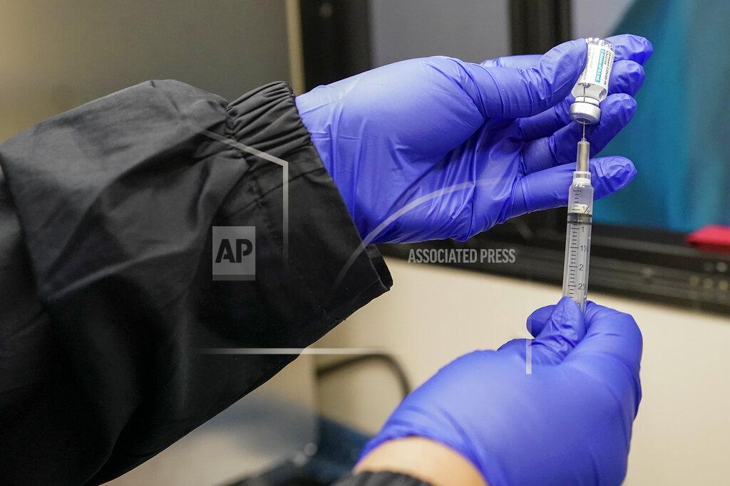 Mary Altaffer A nurse fills a syringe with a dose of the Johnson & Johnson's one-dose COVID-19 vaccine at the Vaxmobile, at the Uniondale Hempstead Senior Center, Wednesday, March 31, 2021, in Uniondale, N.Y. The Vaxmobile, is a COVID-19 mobile vaccination unit, sponsored by a partnership between Mount Sinai South Nassau and Town of Hempstead to bring the one-dose vaccine directly to hard-hit communities in the area. (AP Photo/Mary Altaffer)