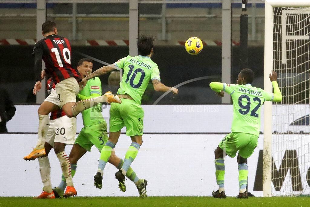 Luca Bruno AC Milan's Theo Hernandez, left, scores the third goal for Milan against Lazio during a Serie A soccer match between AC Milan and Lazio, at the San Siro stadium in Milan, Italy, Wednesday, Dec. 23, 2020. (AP Photo/Luca Bruno)