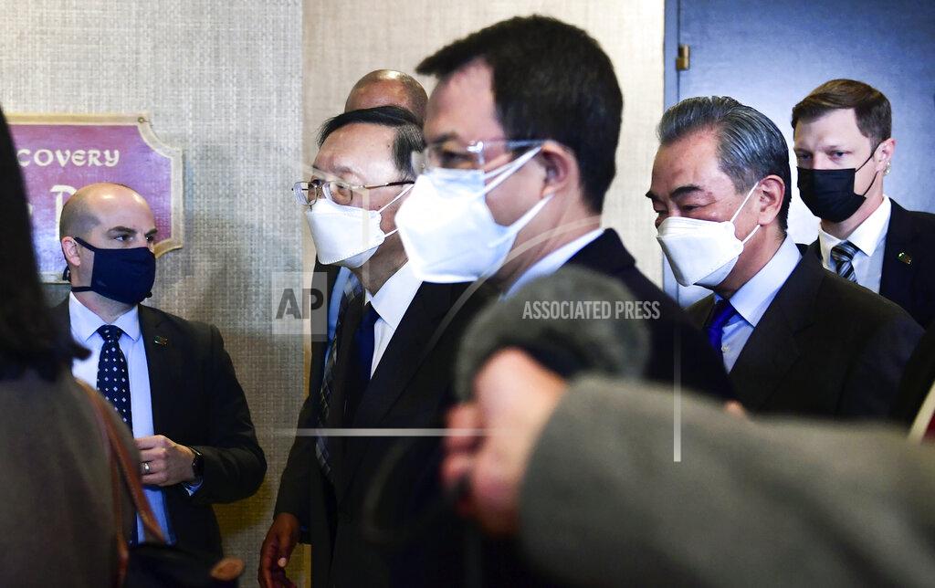 Frederic J. Brown Chinese Communist Party foreign affairs chief Yang Jiechi, second from left, and China's State Councilor Wang Yi, second from right, depart the ballroom from the closed-door morning session of US-China talks in Anchorage, Alaska on Friday, March 19, 2021. (Frederic J. Brown/Pool via AP)