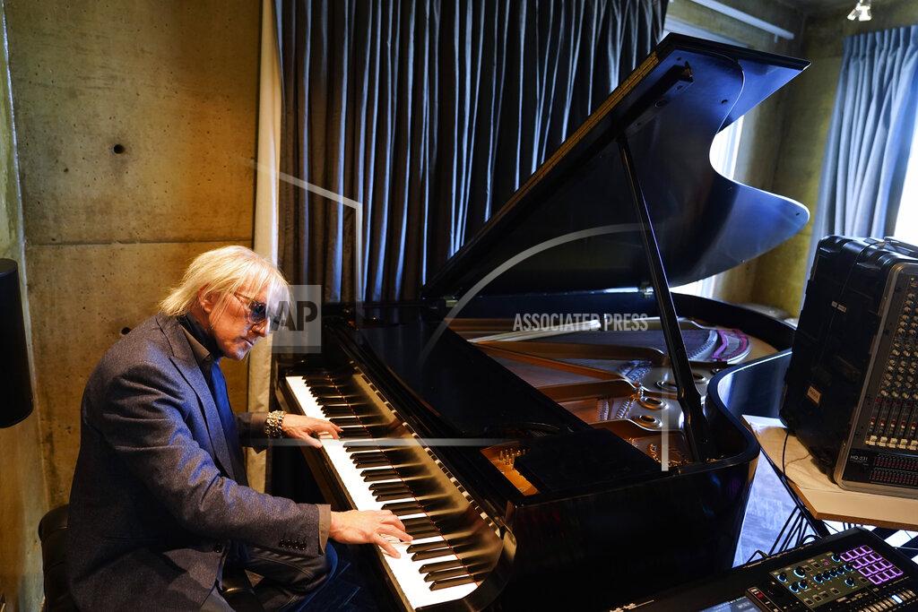 Marcio Jose Sanchez Jed Leiber plays the piano at home Thursday, Dec. 3, 2020, in Los Angeles. (AP Photo/Marcio Jose Sanchez)