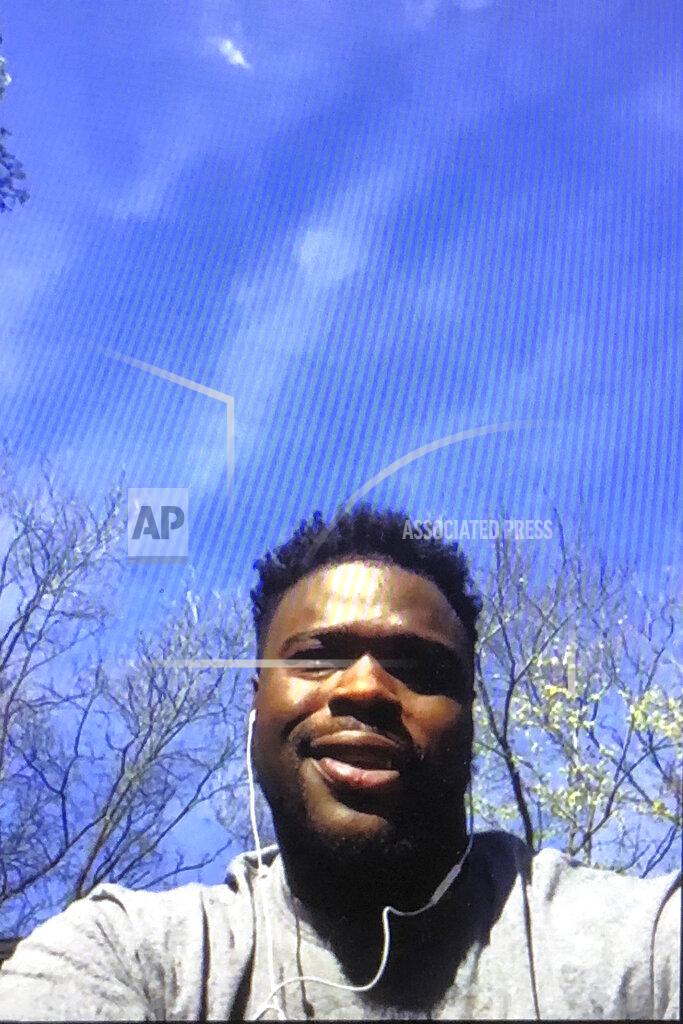 Steve Wine Miami Dolphins NFL football player Shaq Lawson is shown during a Zoom news conference in this photo made in Miami Lakes, Fla., Thursday, March 26, 2020. The Miami Dolphins practiced safe distancing when they introduced eight newly acquired players hunkered down around the country, holding a series of news conferences via Zoom. The technology changed the dynamics of the conversation, and players seemed to like it. (AP Photo/Steve Wine)